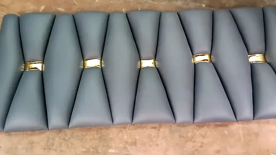 Channel-tufted headboard with gold buttons