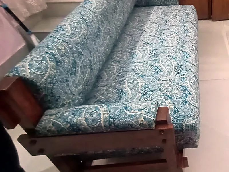 A blue paisley three-piece set with teak arms, in a customer's home