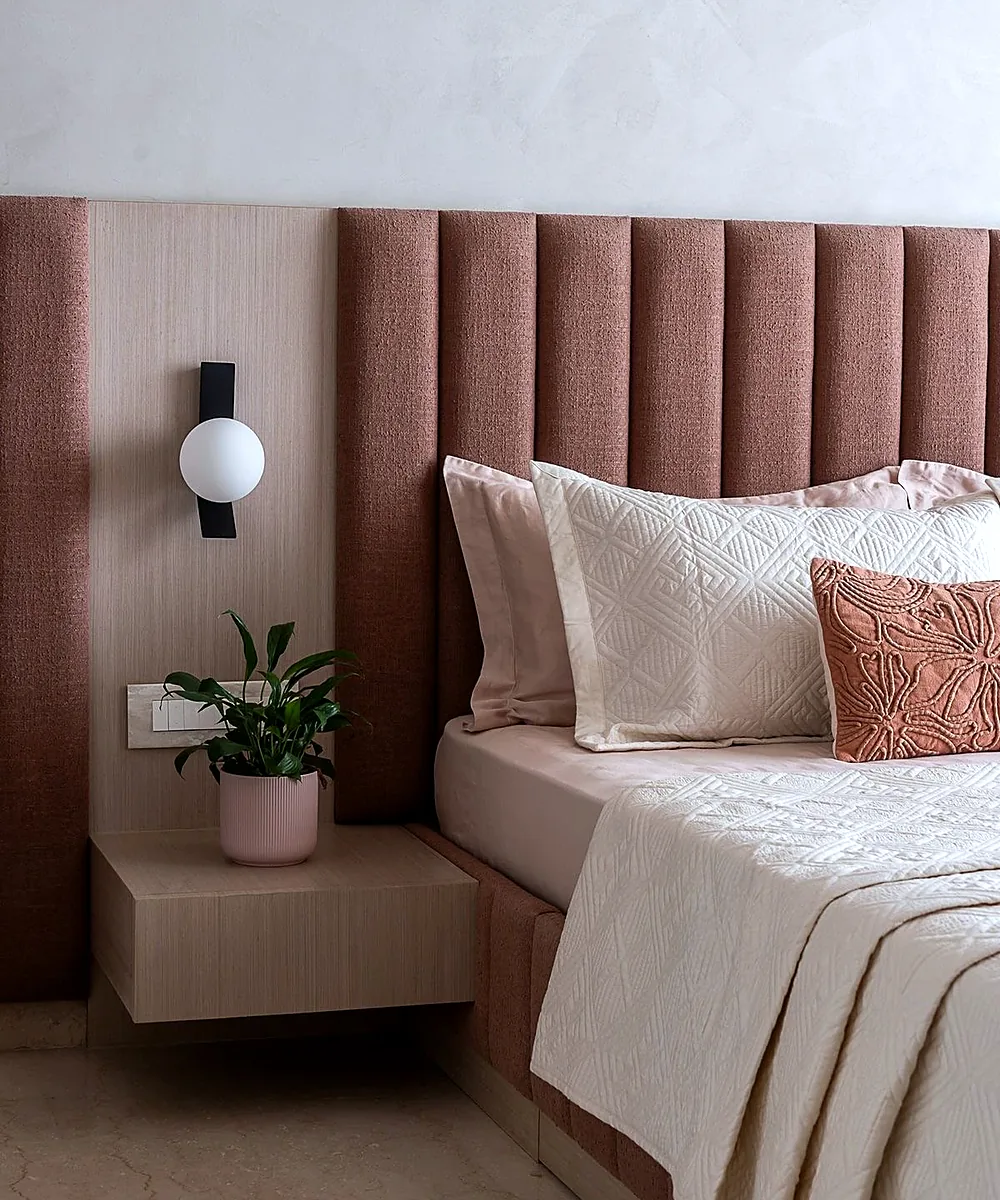 Channel-tufted headboard in a rose fabric