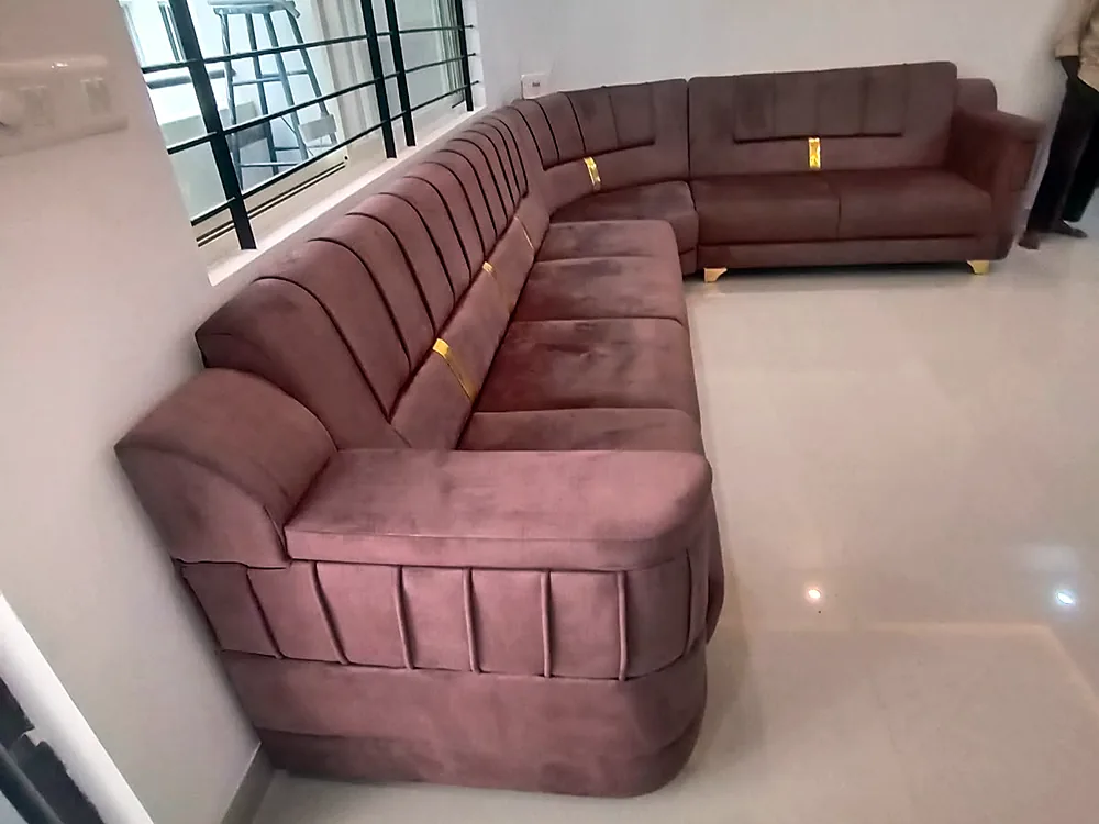 Theeram — curved sectional in a rose fabric