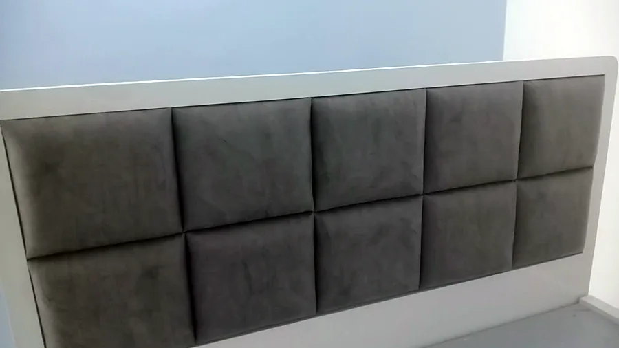 Upholstered headboard panel in a show flat